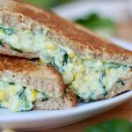 A spinach corn sandwich oozing with creamy spinach corn filling.