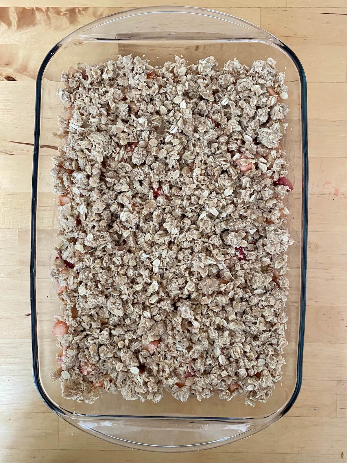 The assembled strawberry apple crisp before being baked.