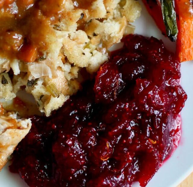 Cranberry sauce with orange juice on a plate of turkey dinner.