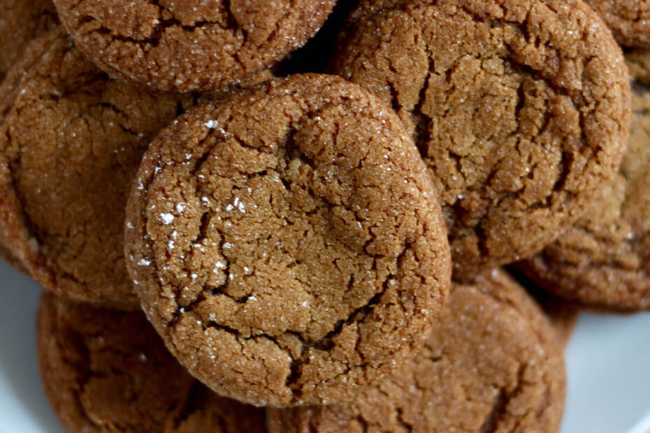 A plate filled with molasses crinkle cookies.