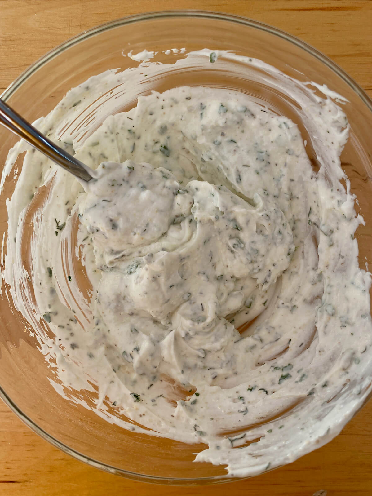 Greek yogurt mixed with dried herbs and spices.