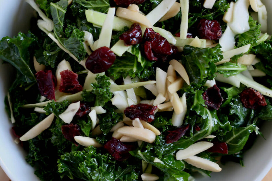 A white bowl filled with kale crunch salad.