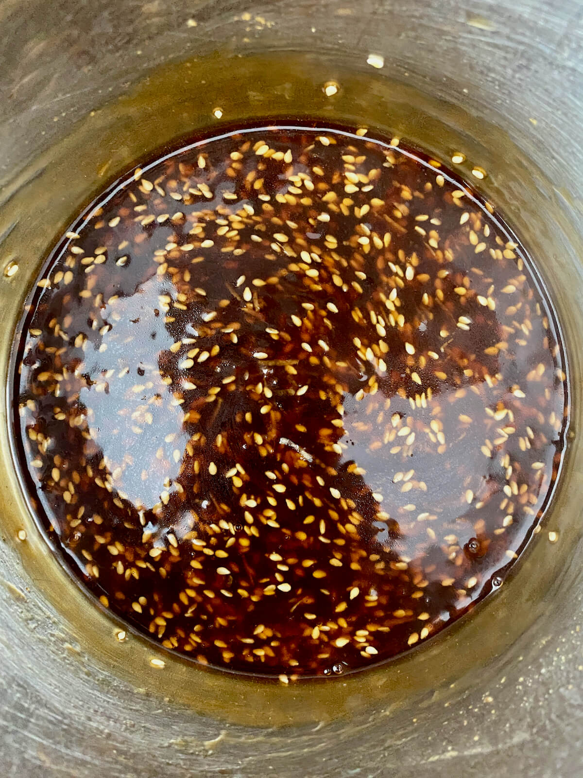 Sesame garlic sauce in a stainless steel pot.