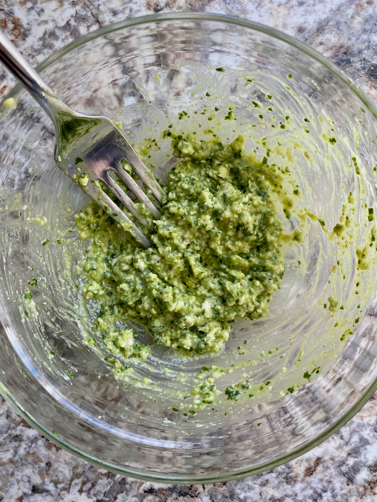 Pesto butter in a small mixing bowl.
