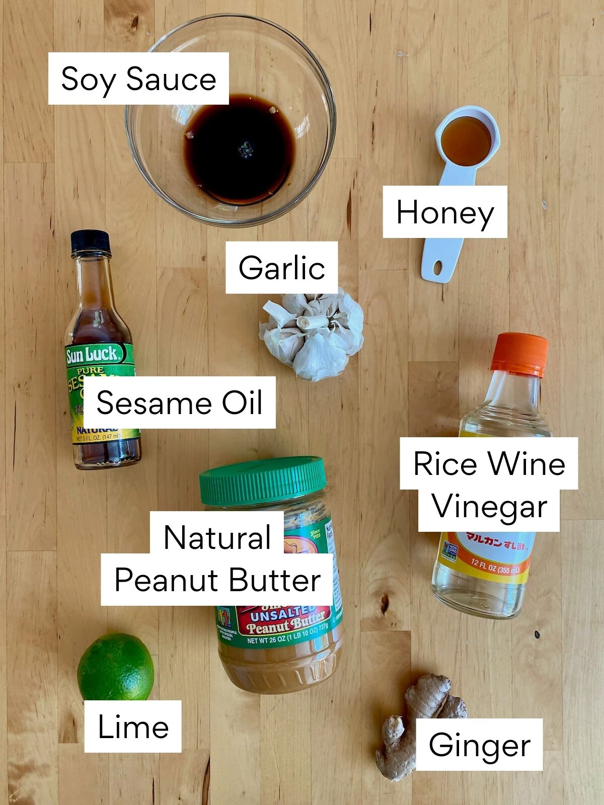 The ingredients to make peanut salad dressing. Each ingredient is labeled with text.