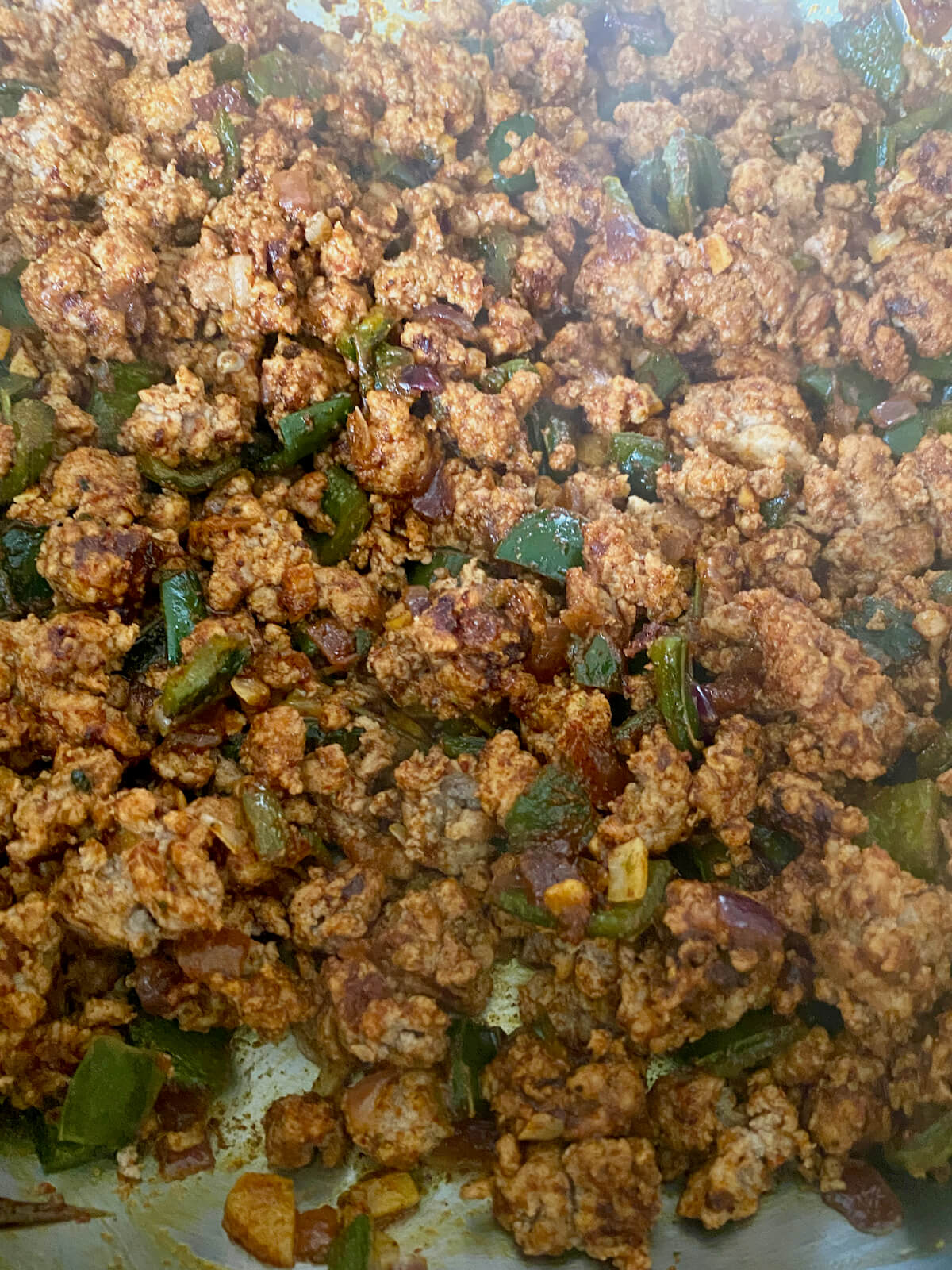 Ground turkey and vegetables seasoned with chili powder, cumin, and other spices.