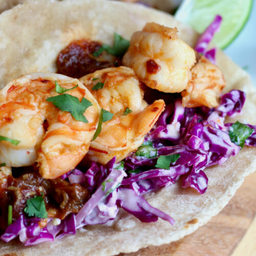 Red cabbage slaw on shrimp tacos.