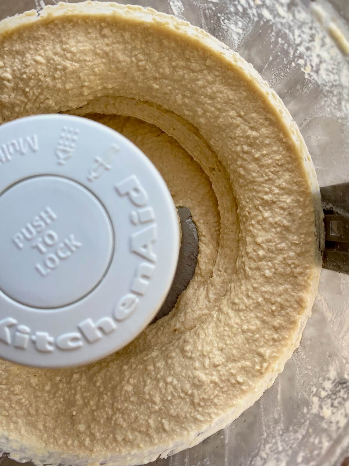 The finished hummus in a food processor.