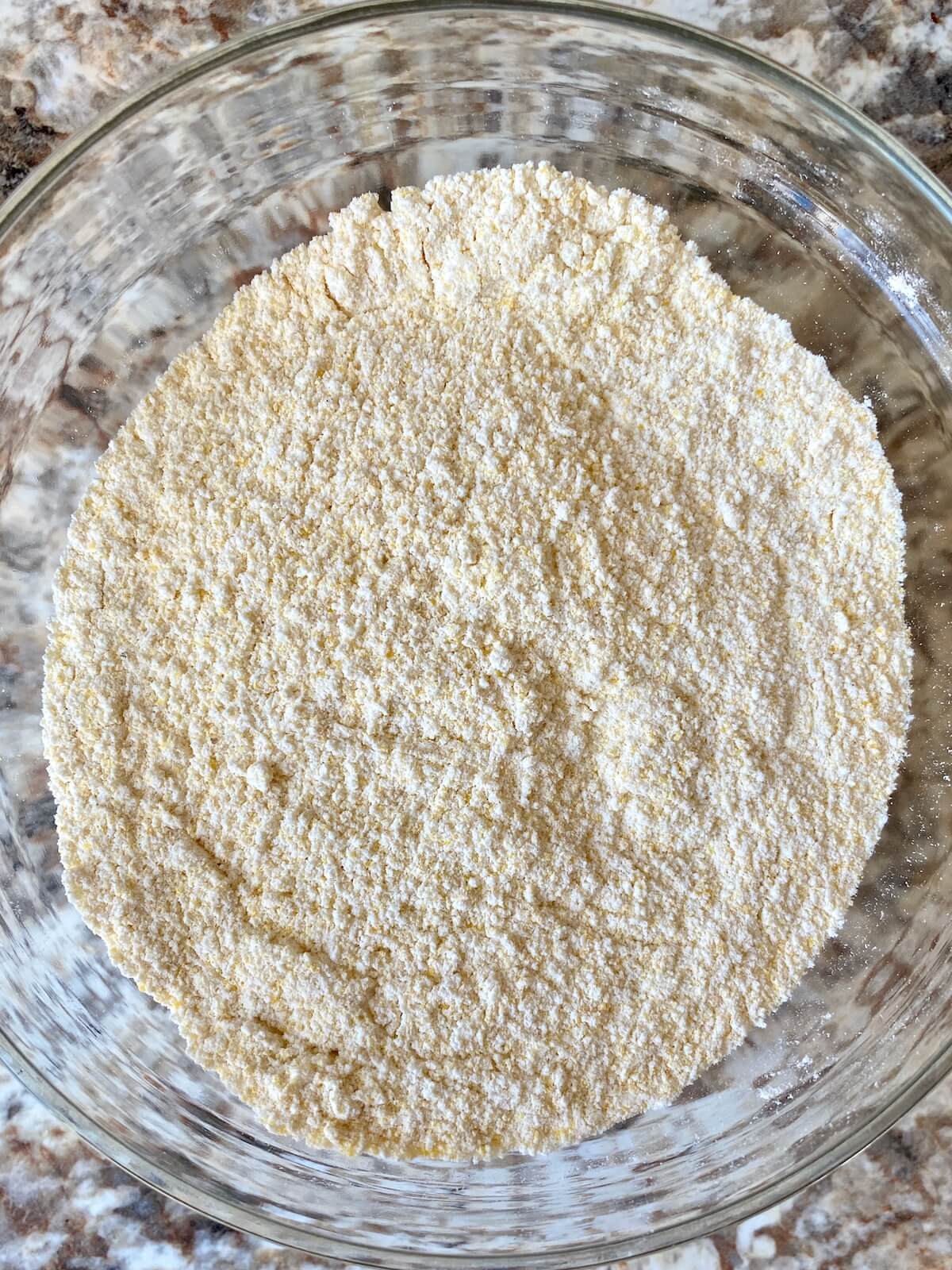 The dry ingredients mixed together in a glass bowl.