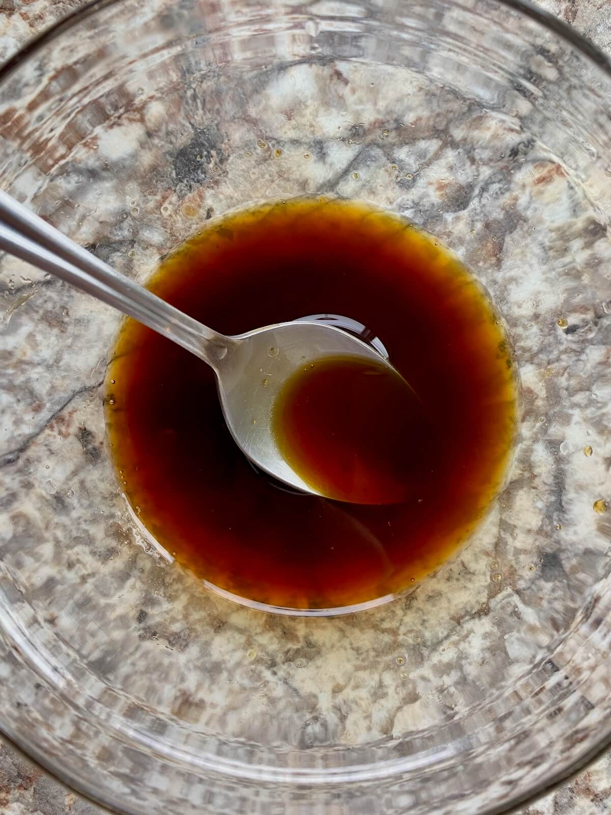 A bowl of molasses mixed with a small amount of water.