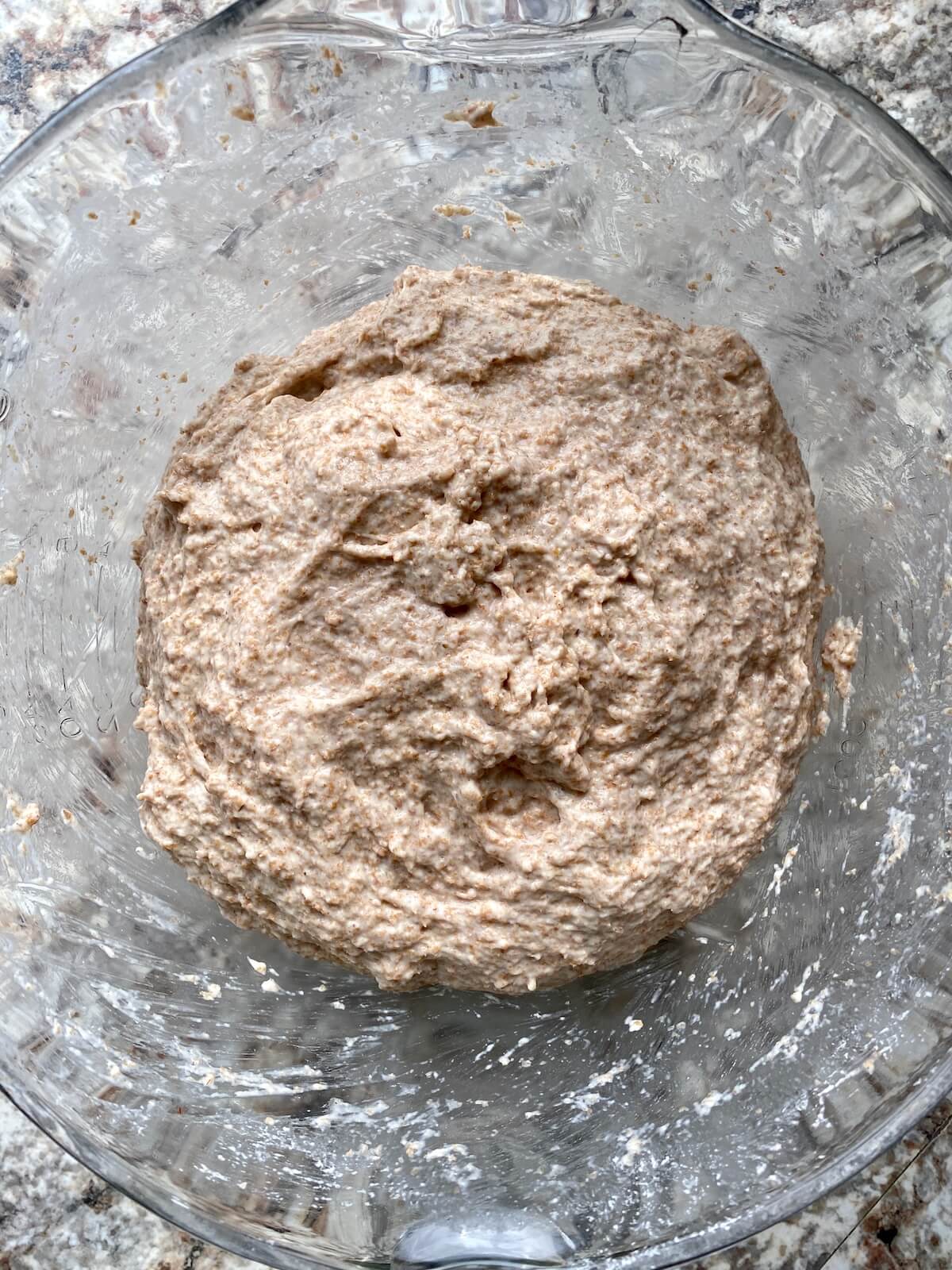 The dough just after being mixed in a glass bowl.