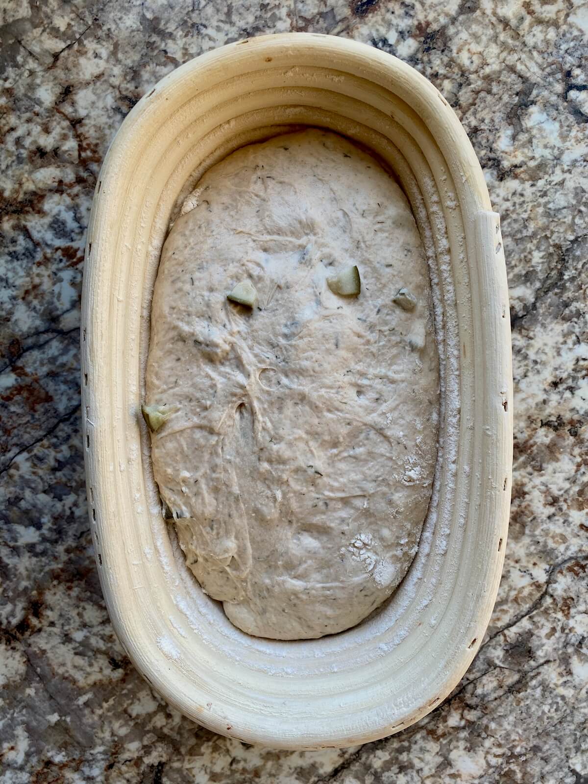 The fermented dough in a batard proofing basket.