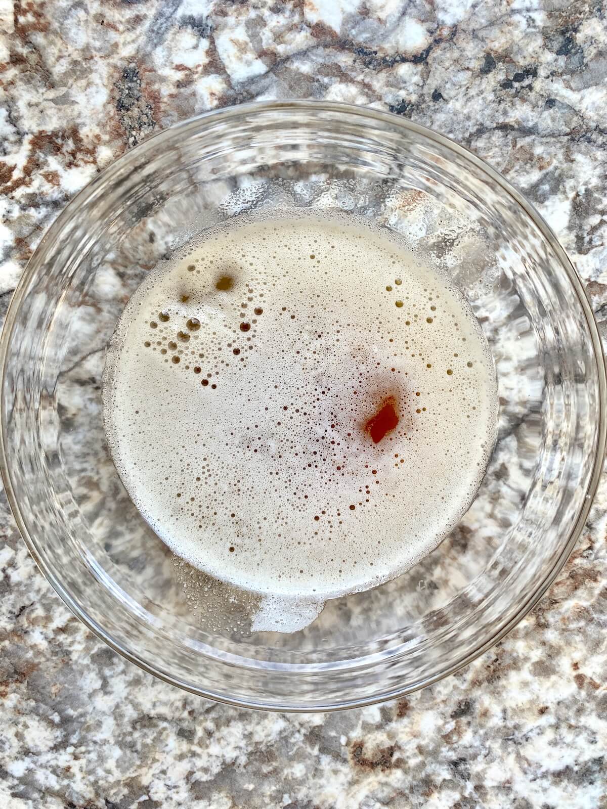 Brown butter in a small glass bowl.