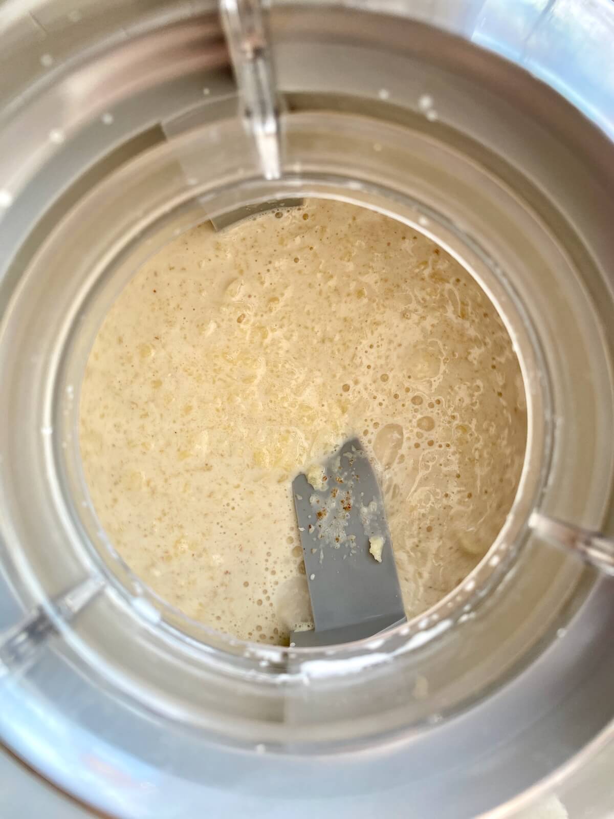 The brown butter sourdough ice cream base in an ice cream machine.