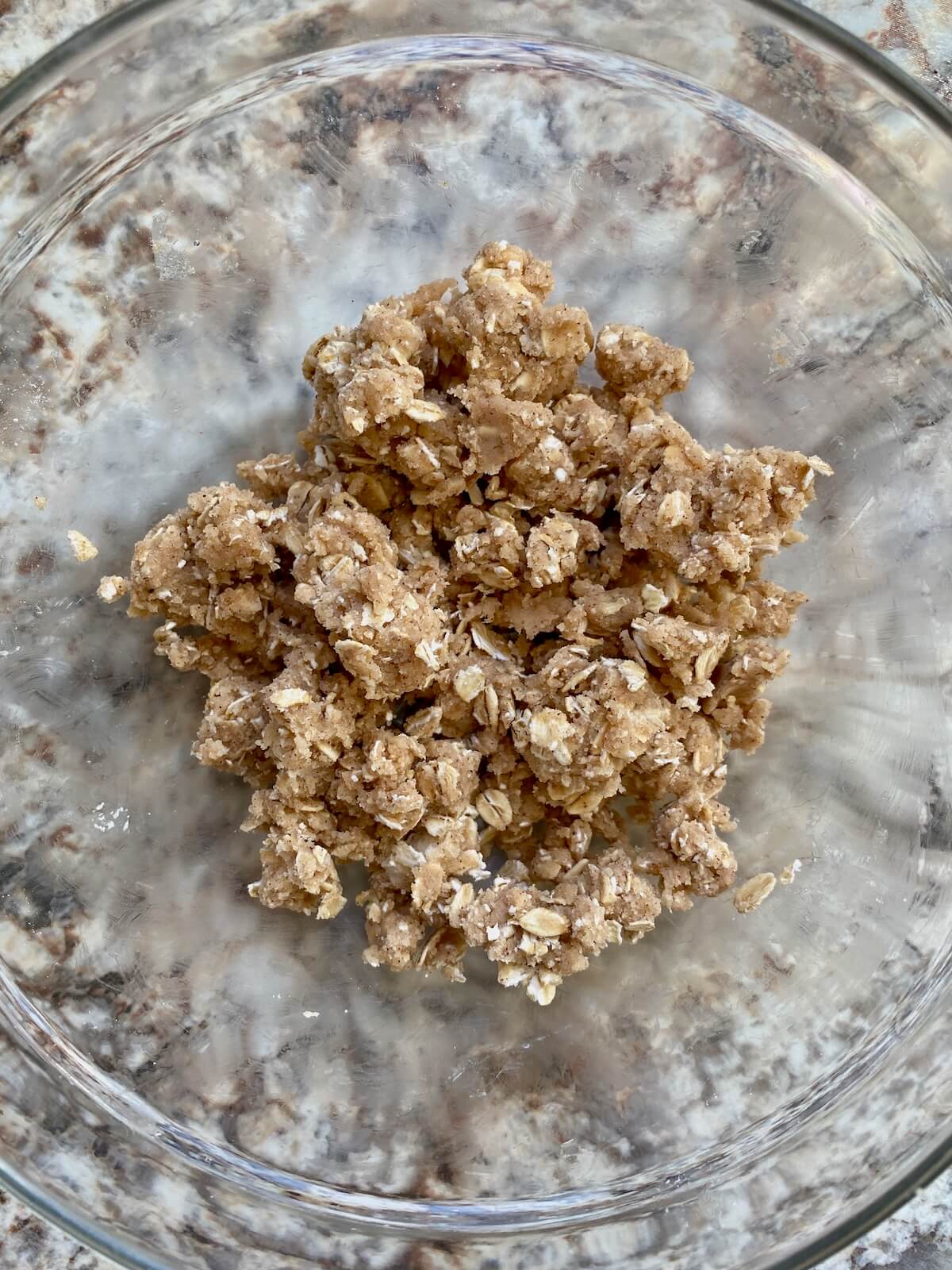 The oat streusel muffin topping in a glass bowl.