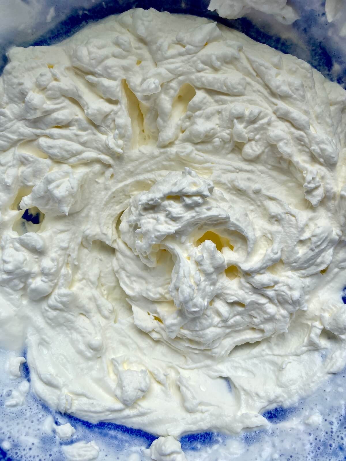 Homemade whipped cream in a bowl.