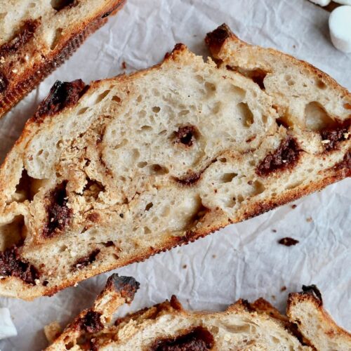 Slices of s'more sourdough bread on a piece of parchment paper.