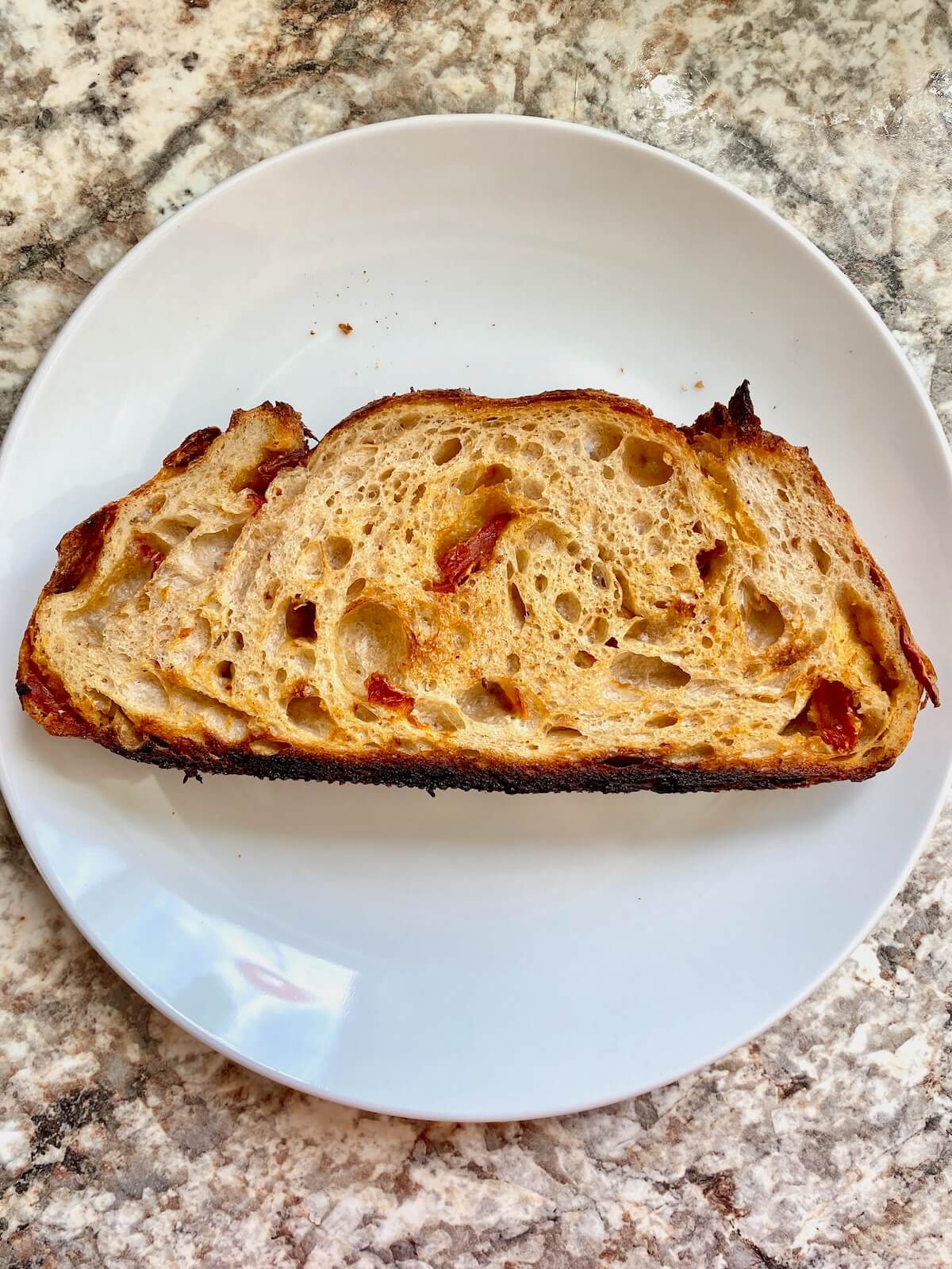 Toasted sourdough bread on a small plate.