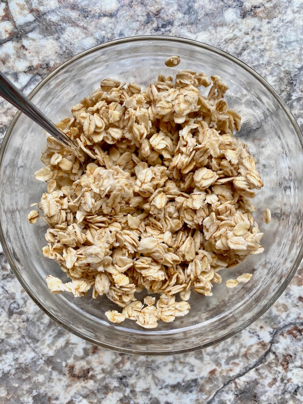 Rolled oats and hot water mixed together in a small bowl.
