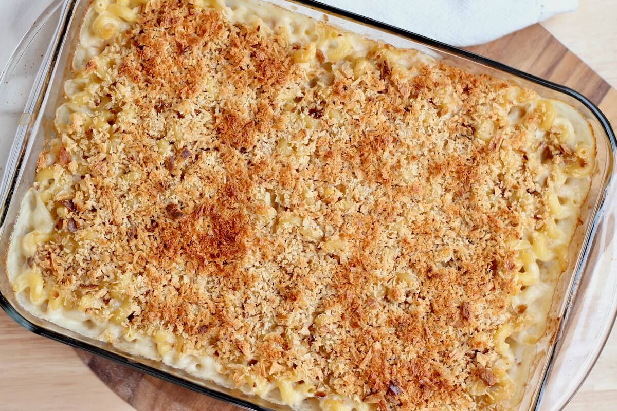 Baked sourdough mac and cheese in a glass casserole dish.