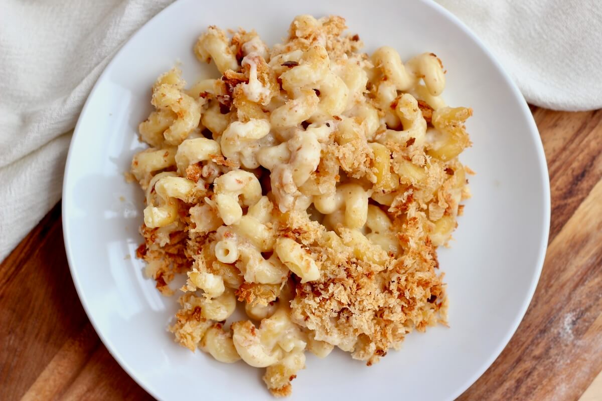 Sourdough discard mac and cheese on a small white plate.