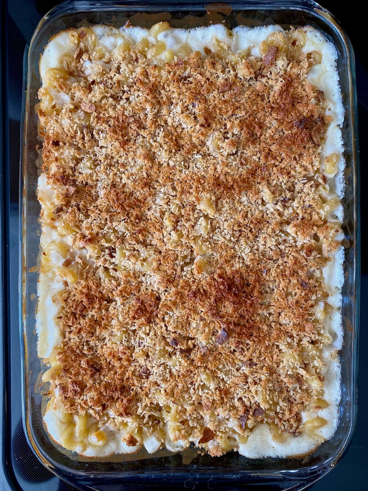 Baked sourdough mac and cheese in a casserole dish.