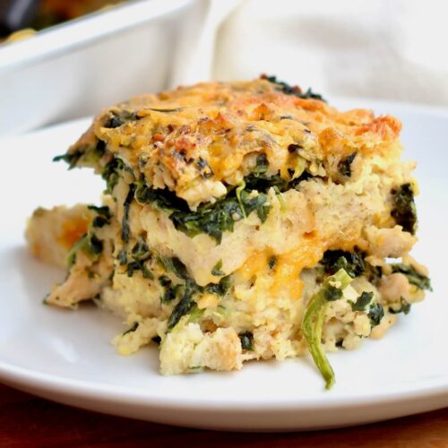 A piece of sourdough strata on a small white plate.