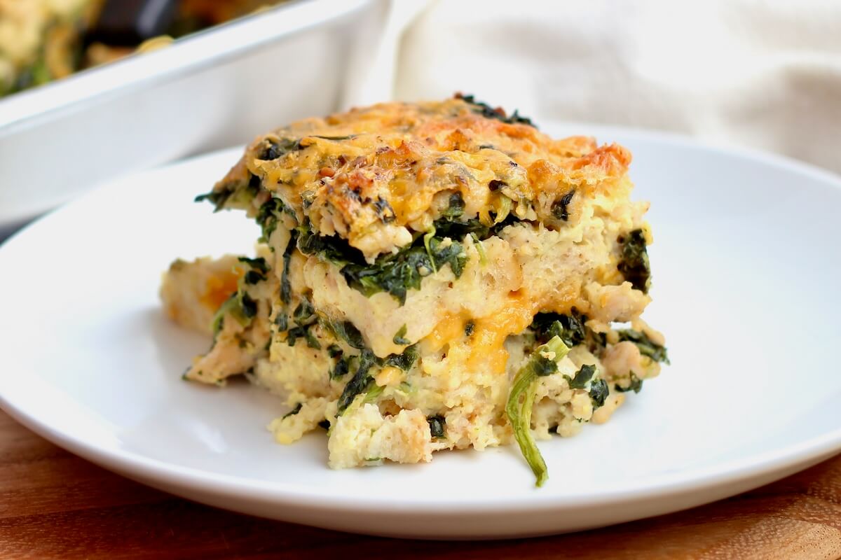 A piece of sourdough strata on a small white plate.
