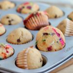 A mini muffin tin filled with sourdough discard mini muffins.