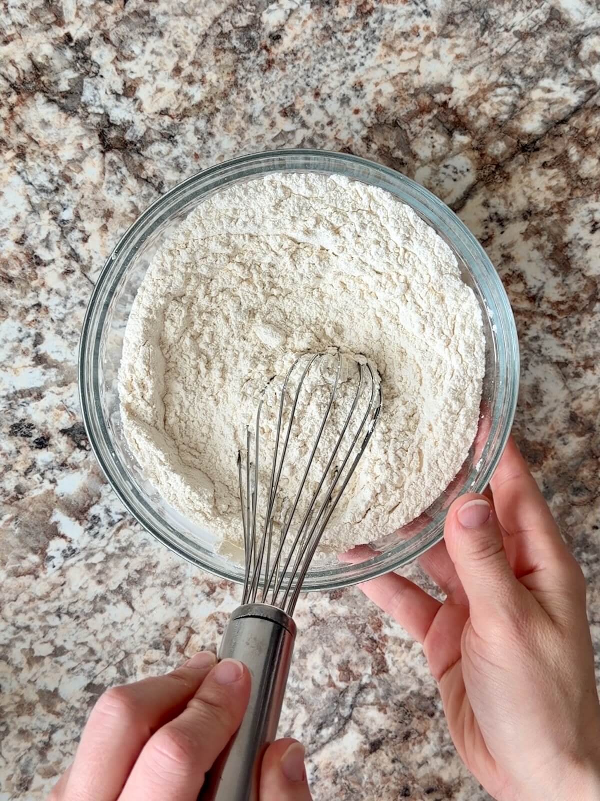 The dry ingredients being whisked together in a bowl.