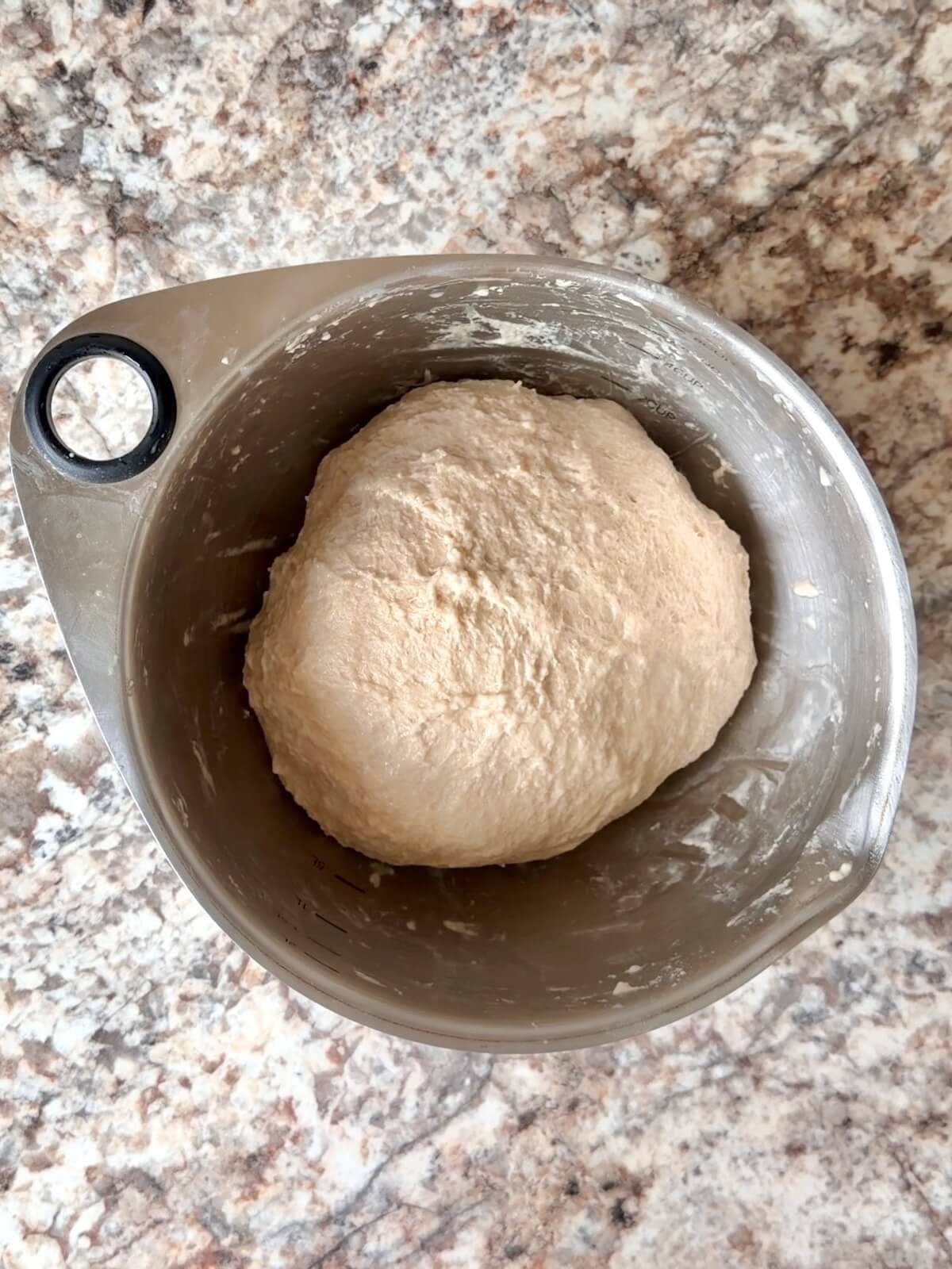 Stretched and folded high protein sourdough bread dough in a bowl.