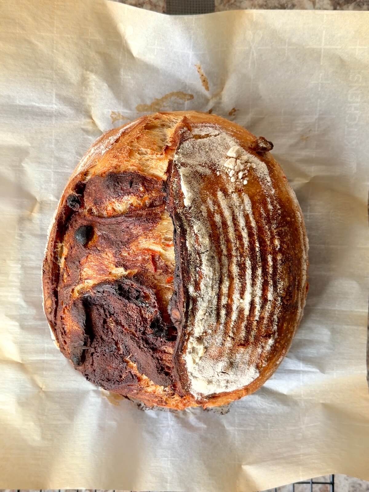 A baked loaf of carrot cake sourdough bread.