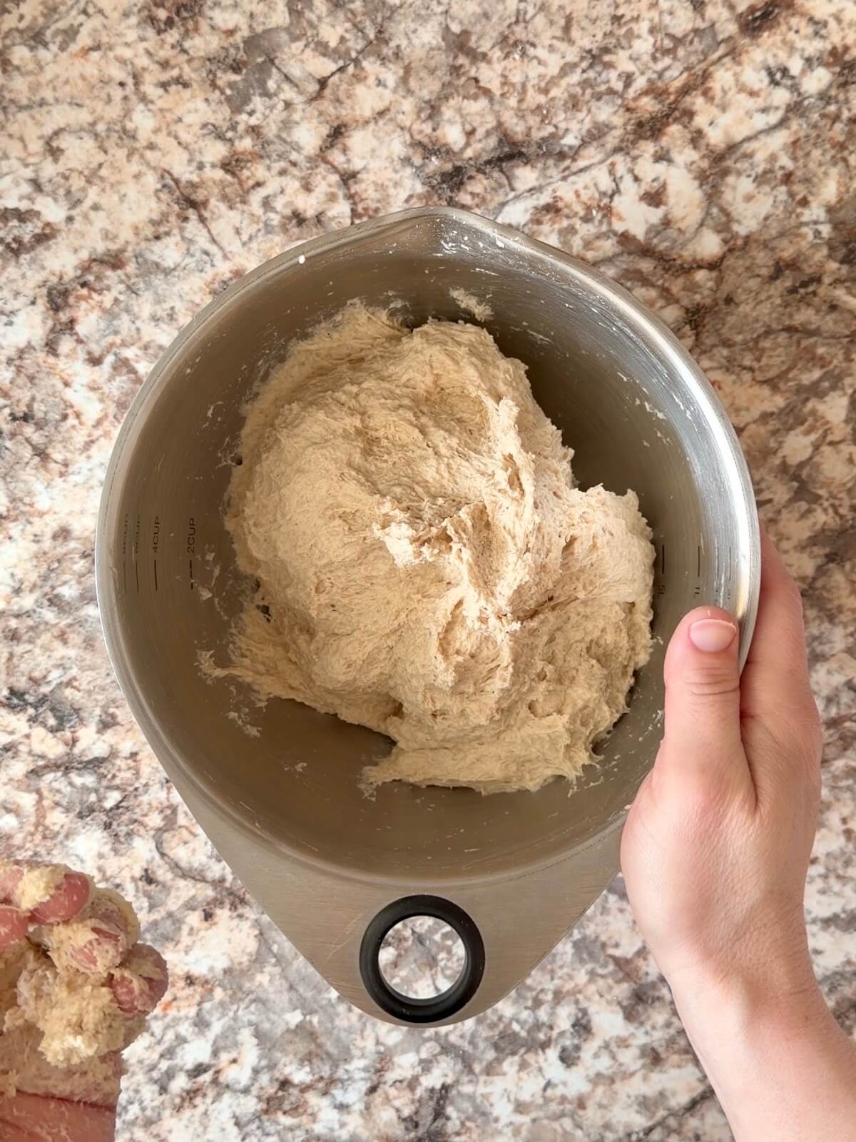 Sourdough bread dough mixed together in a bowl.