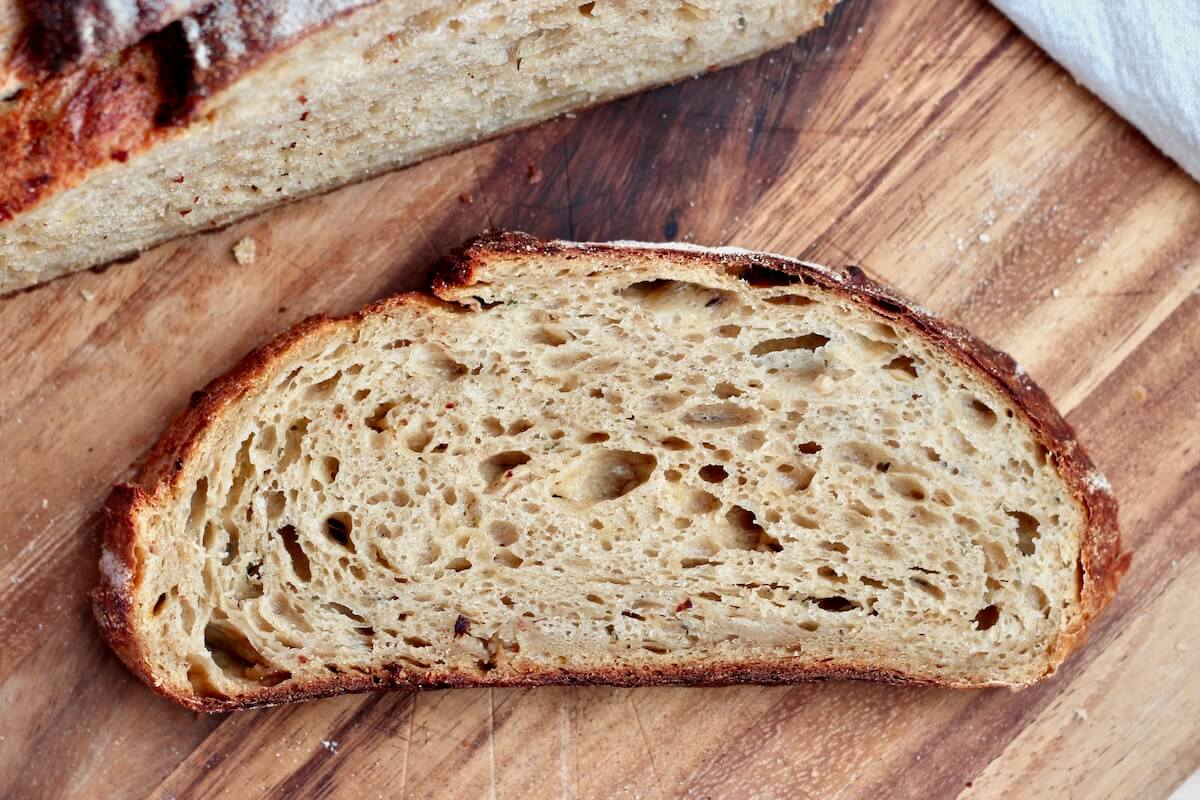 A slice of French onion soup sourdough bread.