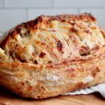 A whole loaf of loaded baked potato sourdough bread.