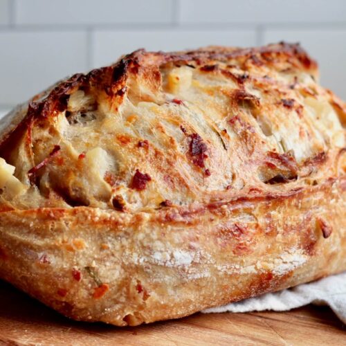 A whole loaf of loaded baked potato sourdough bread.