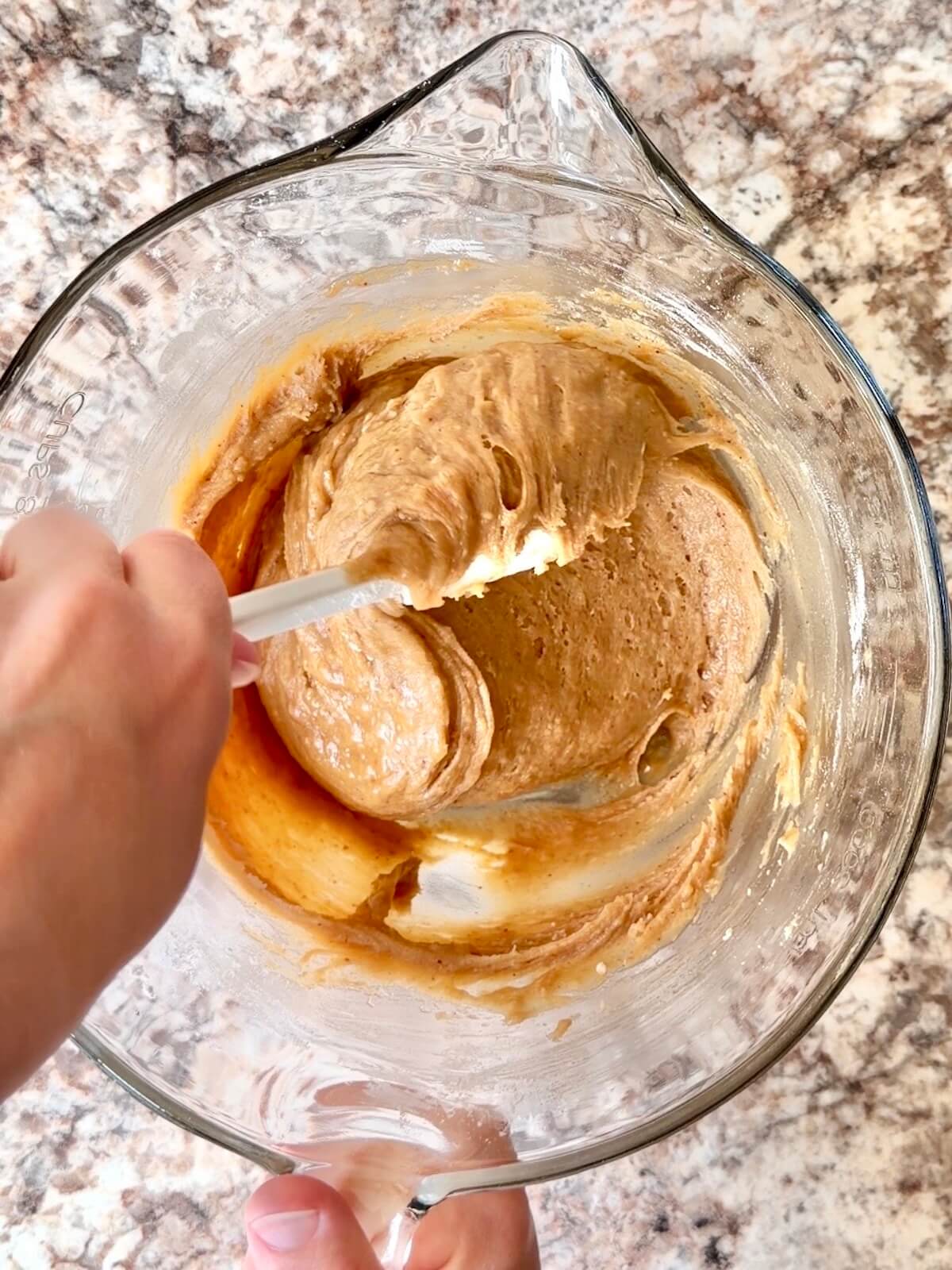Sourdough blondie batter in a large glass bowl.
