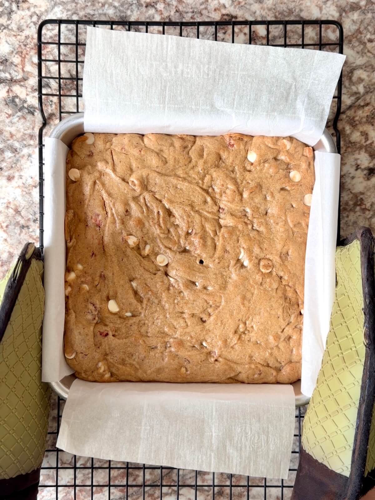 Baked strawberry sourdough blondies in a square baking pan.