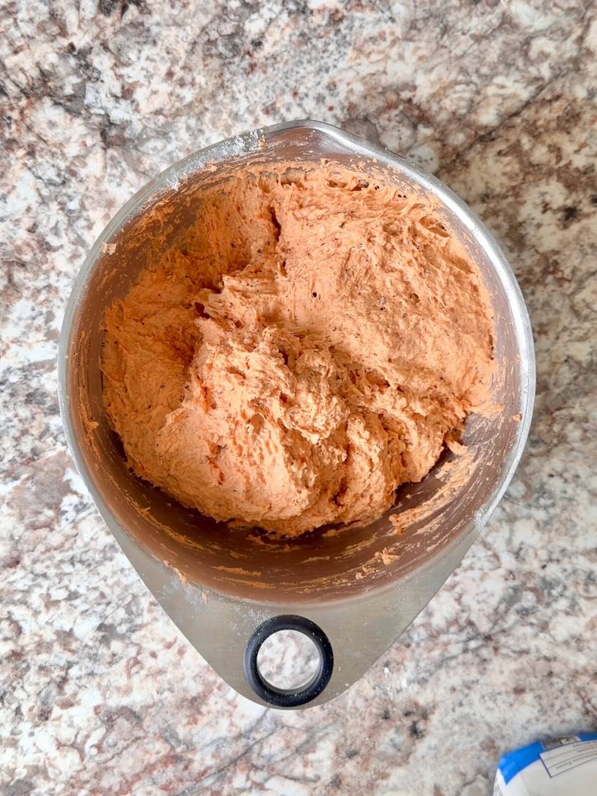 Tomato soup sourdough bread dough in a bowl.