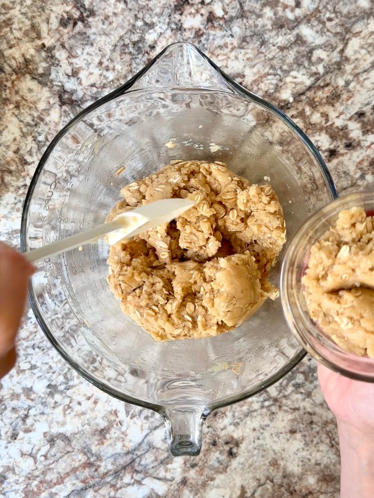 Sourdough raspberry bar oat crumble mixed in a glass bowl.