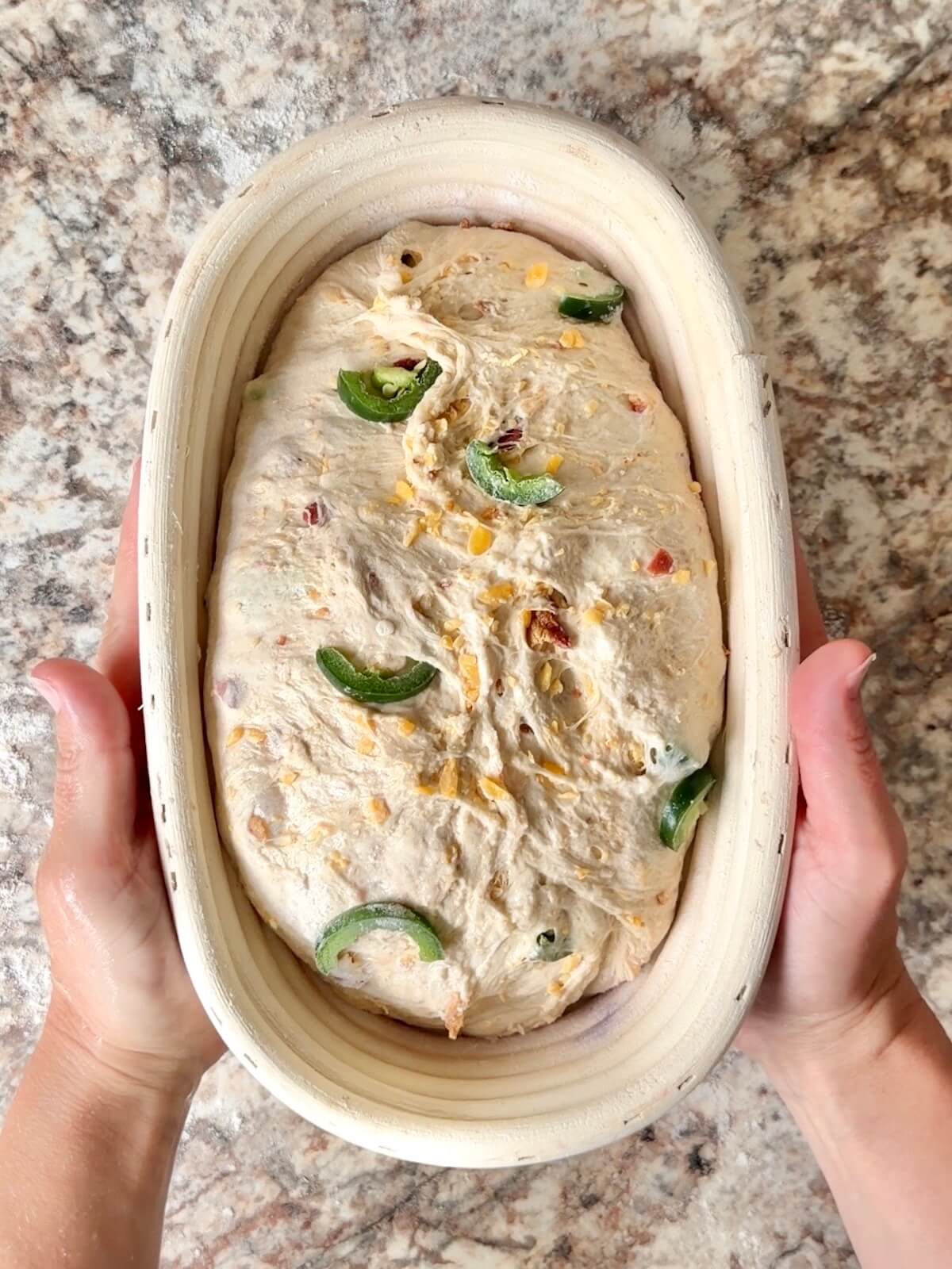 The dough in an oval proofing basket before cold proofing overnight.