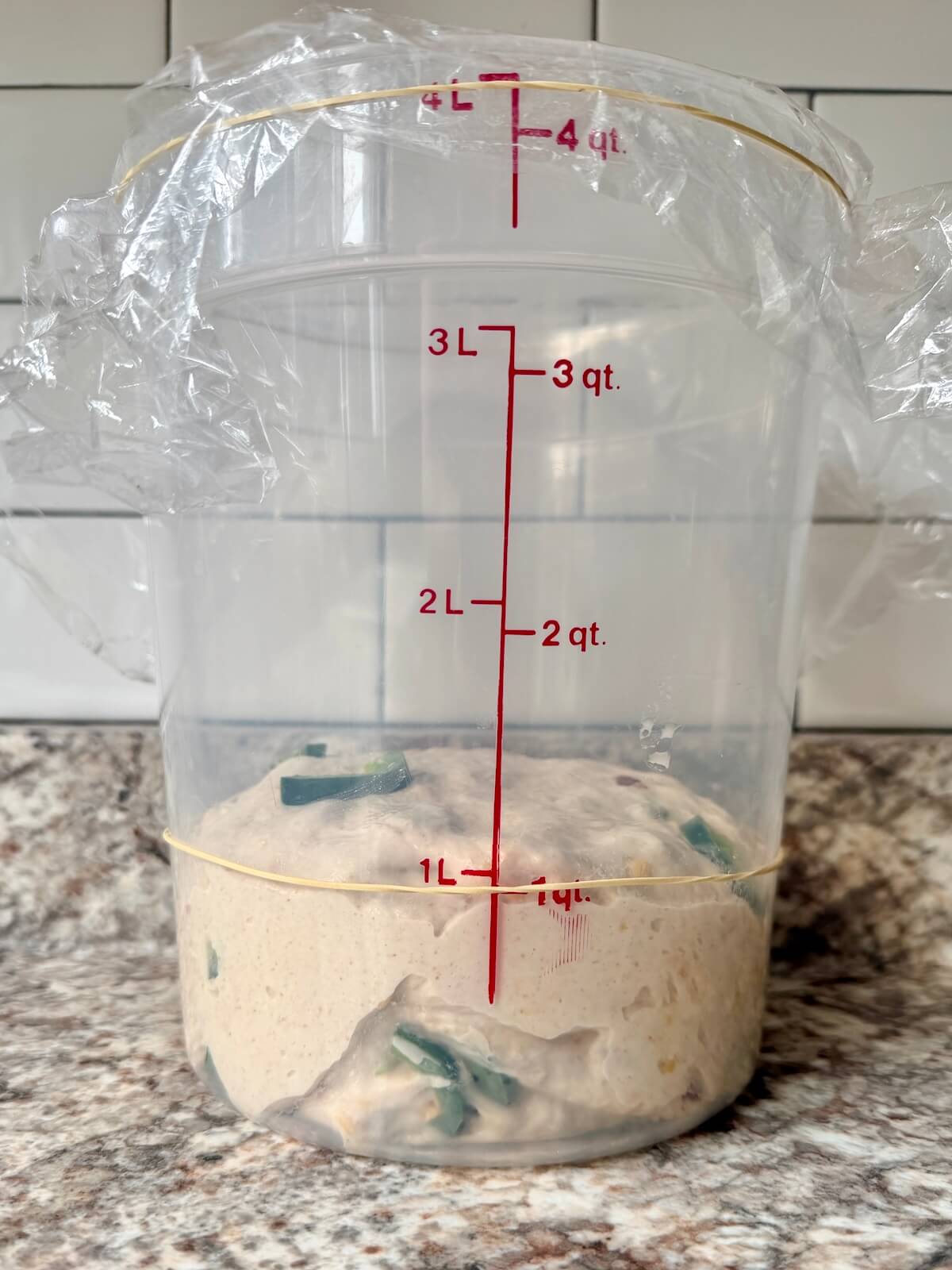 The dough in a straight-sided container before bulk fermenting.