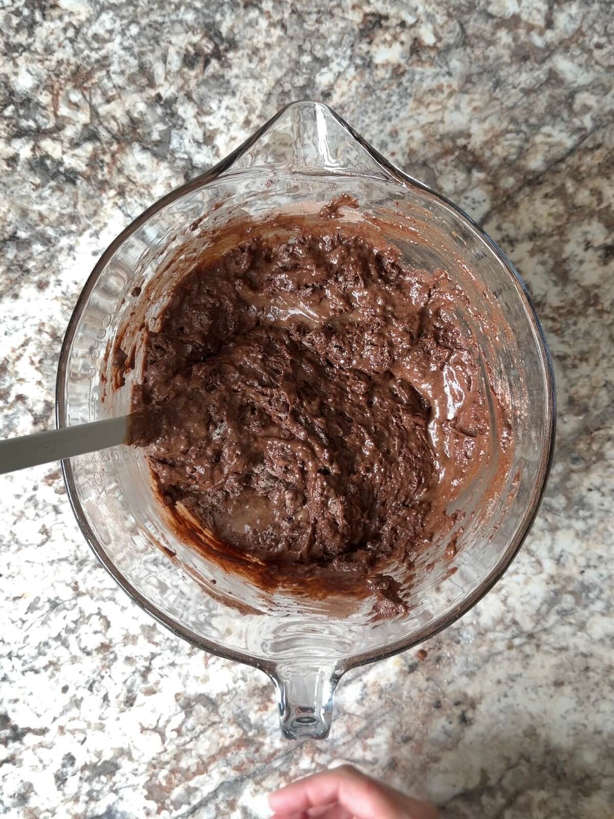 The wet and dry ingredients mixed together in a bowl.