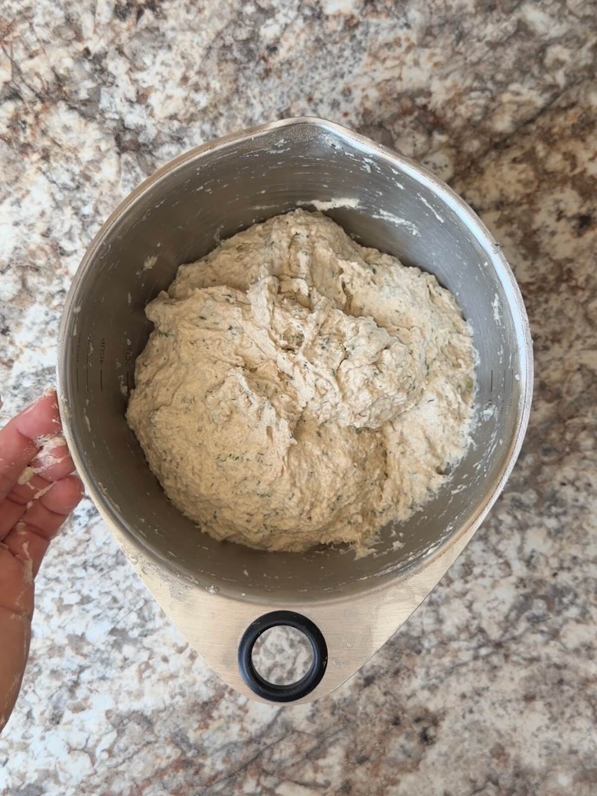Buffalo chicken sourdough bread dough in a mixing bowl.