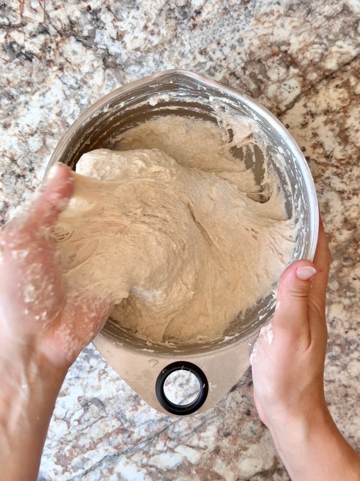 Sourdough focaccia bread dough in a mixing bowl.