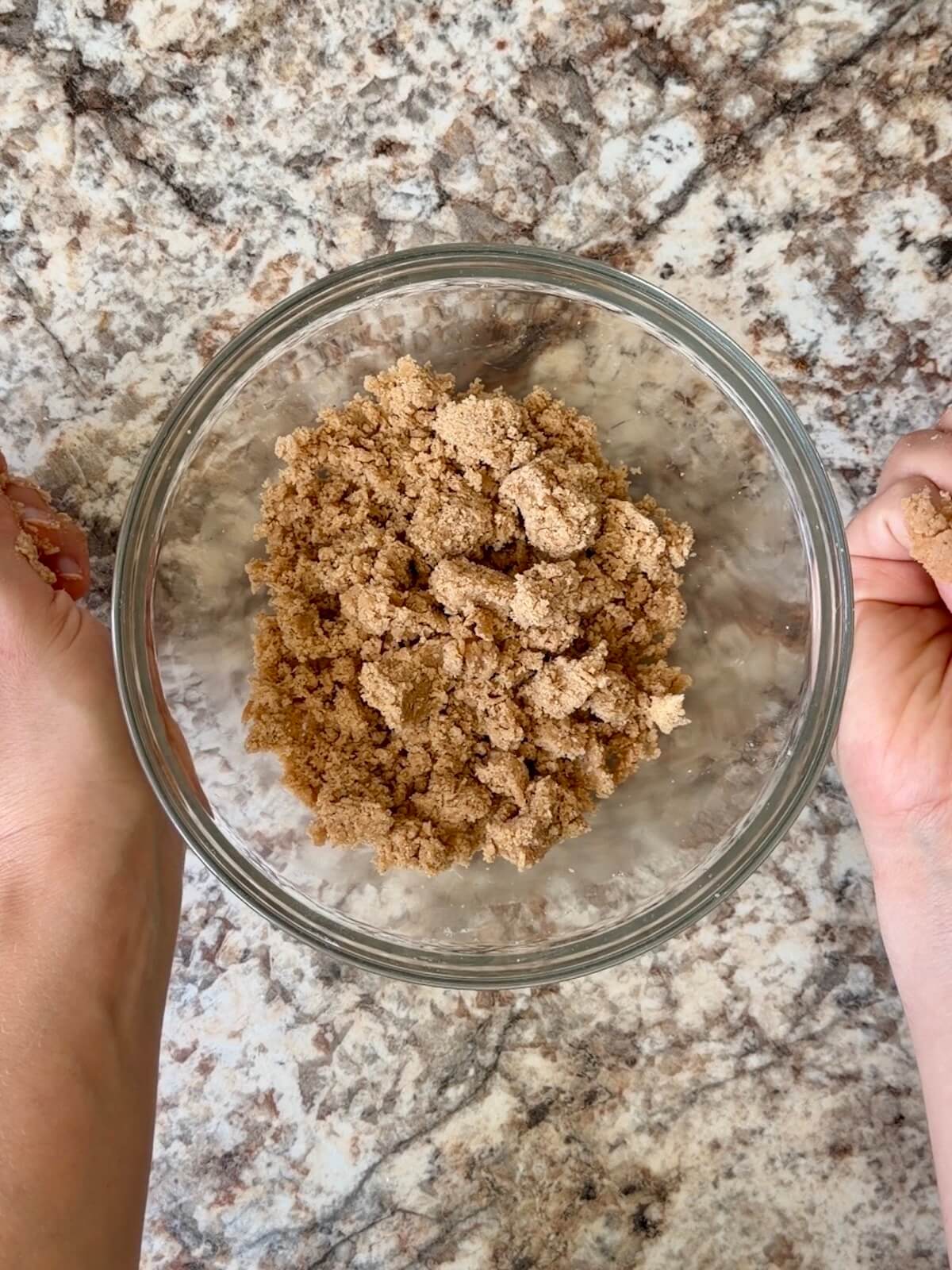 Cinnamon streusel mixed together in a glass bowl.