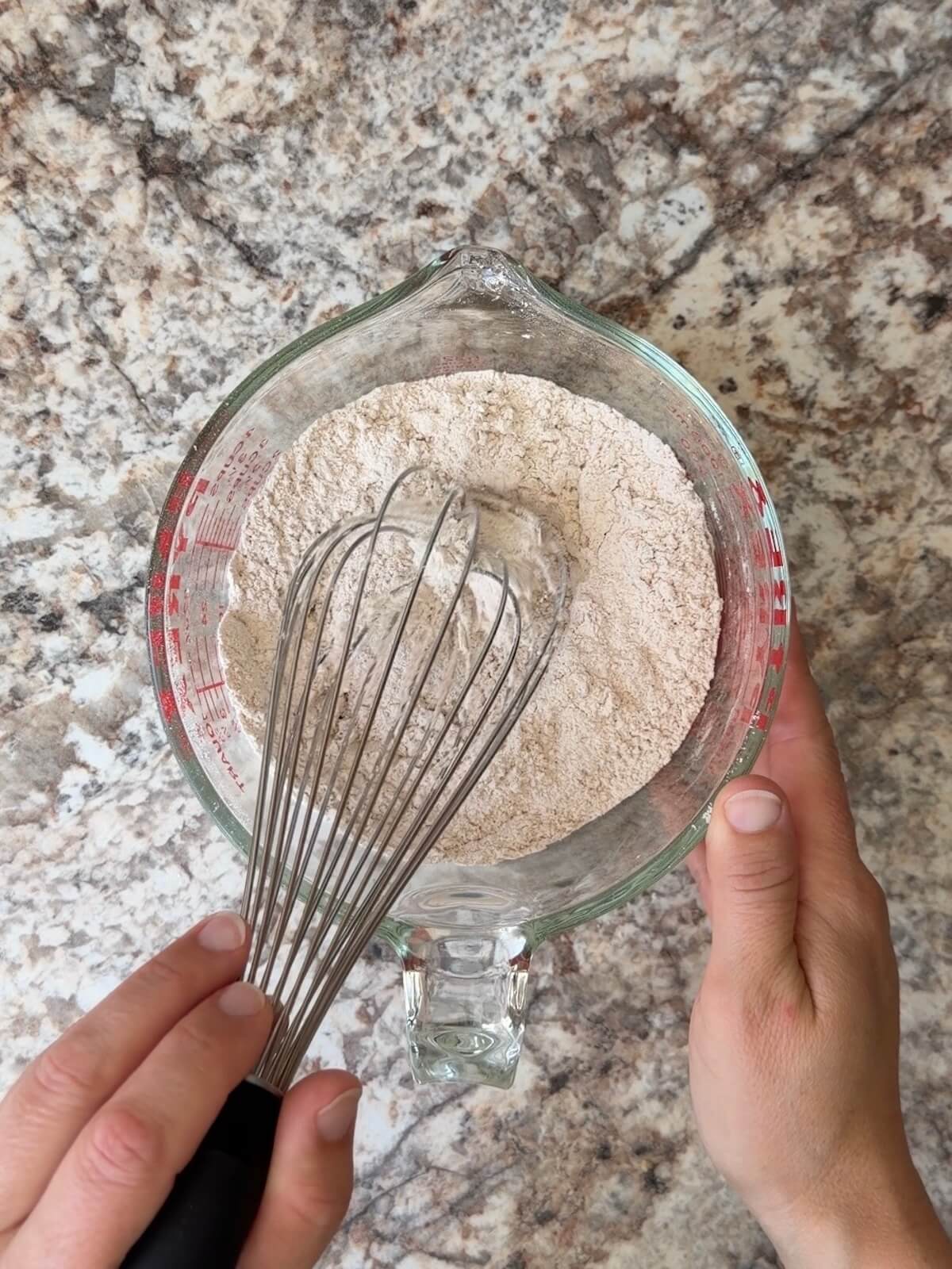 The dry ingredients whisked together in a glass measuring cup.