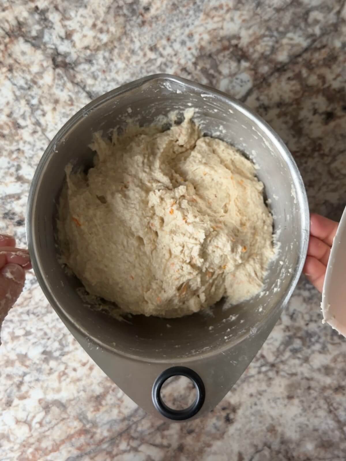 Orange-flavored sourdough bread dough in a mixing bow.
