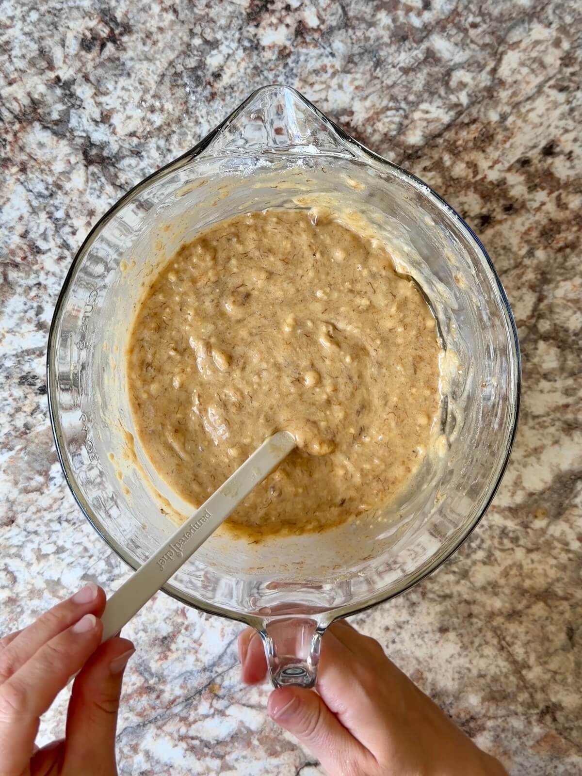 Sourdough banana muffin batter in a mixing bowl.